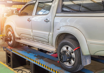 Car wheel alignment maintenance for balance at service station center 