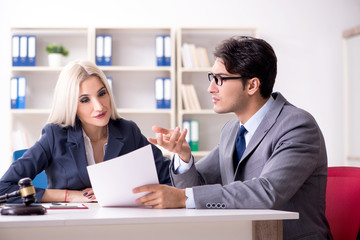 Lawyer discussing legal case with client