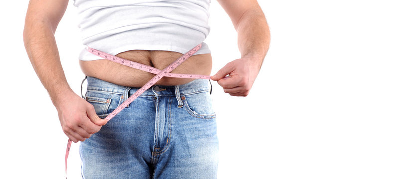 Overweight man with tape measure around waist