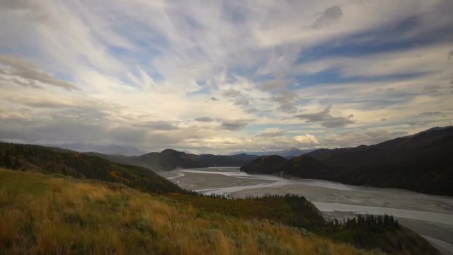 The vast Chitina River flows under a developing storm in Wrangell St-Elias National Park