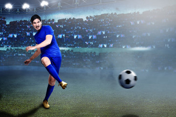 Fototapeta premium Professional asian football player pass the ball