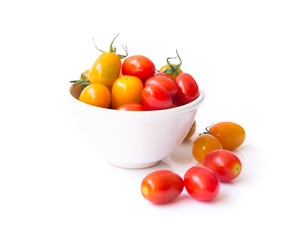 Fresh cherry tomatoes in bowl on white background
