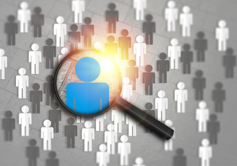 Searching for the best job candidate and people finder concept looking for the right person to stand out from the crowd.  Top pick and best choice for fitting the skillset that HR is looking for.