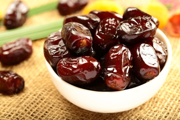 Bowl of delicious and healthy  organic wild date fruits 