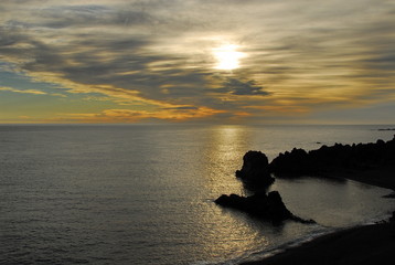 Iceland. The beach with picturesque rocks of petrified lava