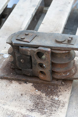 Old hand tool for bending pipe is fixed on a tree