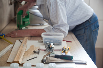 man installing kitchen - DIY concept
