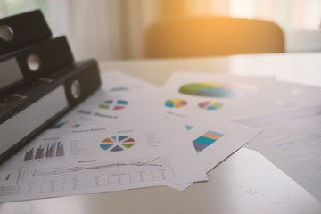new plan financial graph data on office table with laptop and digital tablet for Business team colleagues discussing,vintage color