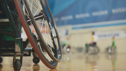 Handicapped basketball player in a wheelchair during sportive training