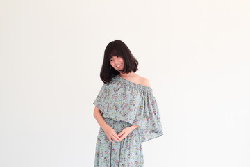 Fashion Portrait of Young  asian woman with short hair style wearing vintage Floral dress - copy space white background