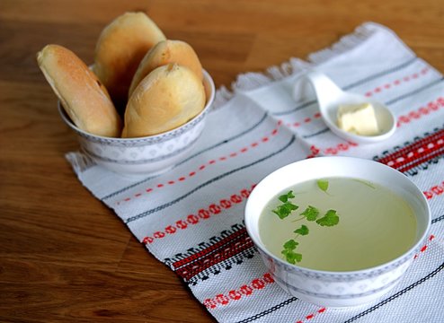 Chicken soup broth. Served with patties with green onions and egg	
