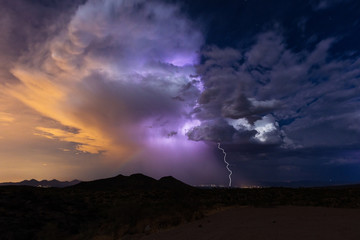 Naklejka na ściany i meble Thunderstorm and lightning bolt strike during the summer monsoon.