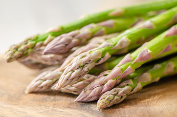 Fresh and green asparagus on the wooden table,