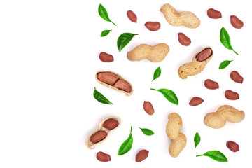 Peanuts decorated with green leaves isolated on white background, top view. Flat lay pattern