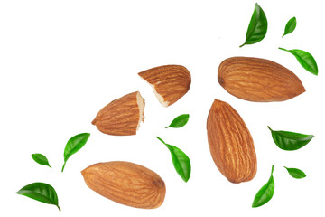 almonds decorated with leaves isolated on white background with copy space for your text. Top view. Flat lay pattern