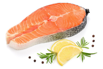 Slice of red fish salmon with lemon, rosemary and peppercorns isolated on white background