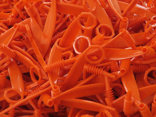 orange colored kitchen gear to slice vegetables