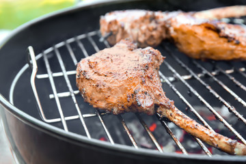Cooking of appetizing juicy spare ribs outdoors