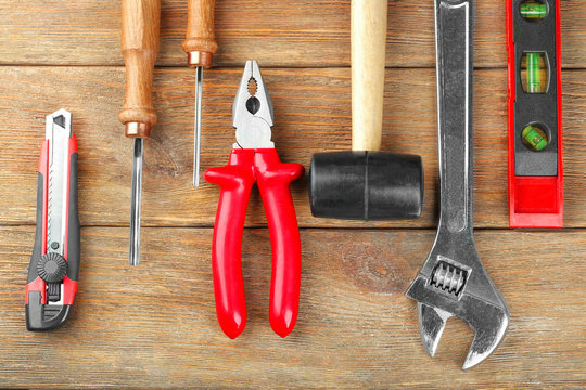 Set of tools on wooden background