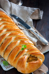 Kulebyaka with cabbage, traditional pie in Russian cuisine, selective focus
