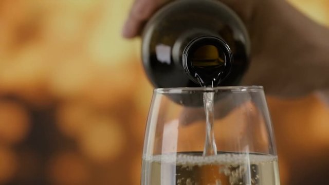 Cinemagraph - Pouring a glass of white wine. Motion Photo.