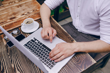 man with laptop in cafe