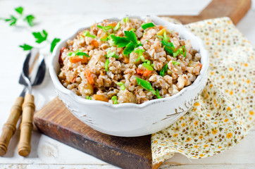 Buckwheat stewed with vegetables: zucchini, carrots, bell peppers, tomatoes and onions