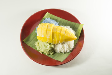 mango and sticky rice On a white background(Thai food)/Steamed rice with coconut milk and...