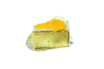a piece of cake topping with yellow jams on white background isolated