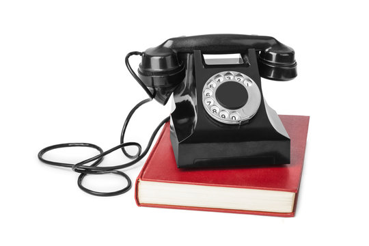 Vintage telephone and book