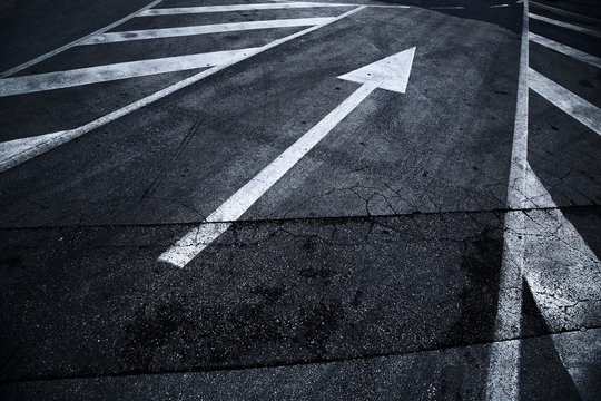 City Asphalt Road With Arrow Sign Background.