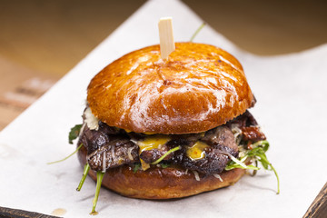 Great Burger beefon a wooden table