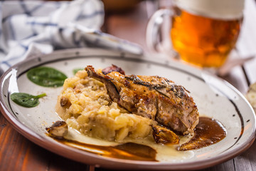 Iberian cutlet with mashes potatoes decoration and draft beere in pub or restaurant