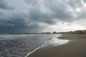 empty sandy beach on cloudy day, Anzio, Italy
