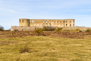 Historic castle ruin at Borgholm, Oland in Sweden. Here seen from a distance across the nearby landscape. A popular travel destination with historic values.
