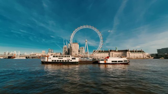 Ultra wide angle shot of the Thames and river banks of London, England, UK featuring the famous London Eye