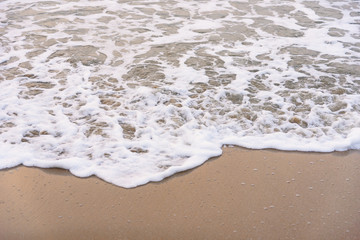 Fototapeta na wymiar Ocean waves exhausted on the beach.