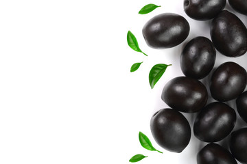 whole black olives decorated with leaves isolated on white background with copy space for your text. Top view. Flat lay