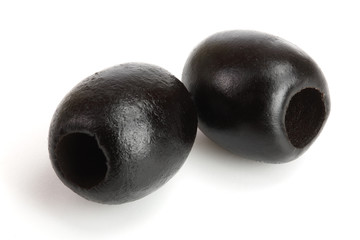 whole black olives isolated on white background macro