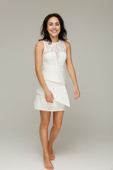 Beautiful fashionable woman in a white dress