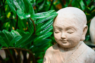 Fototapeta na wymiar Stone statue used to decorate the garden.