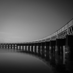 the Tay bridge going over the river Tay on a calm day - 201180464