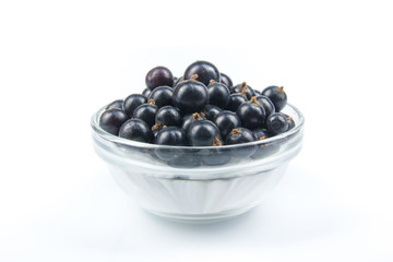 Fresh currant on plate on Isolated white background. Berries