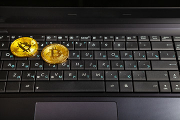 Bitcoins on a laptop