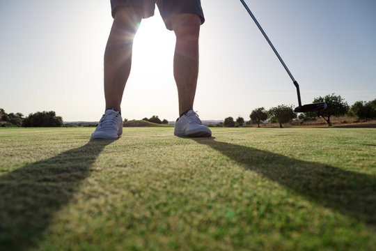 Golfer player with putter club