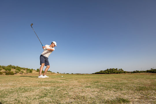 Action Shot Of Golf Player Ready For Tee Off