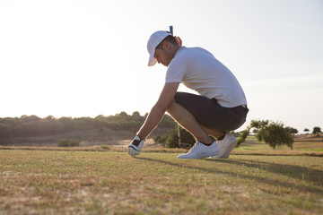 Golfer preparing for tee off