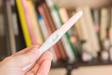 Pregnancy test in a human hand.