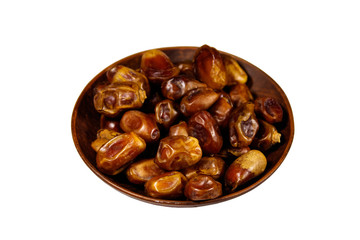 Dried date fruits in ceramic plate isolated on white background
