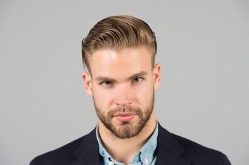 Businessman with beard and mustache on unshaven face. Bearded man with stylish hair or haircut....
